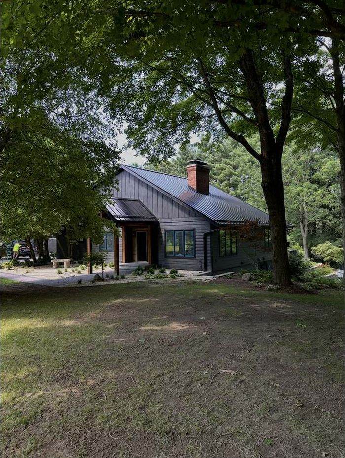 Completed house exterior renovation with new entry