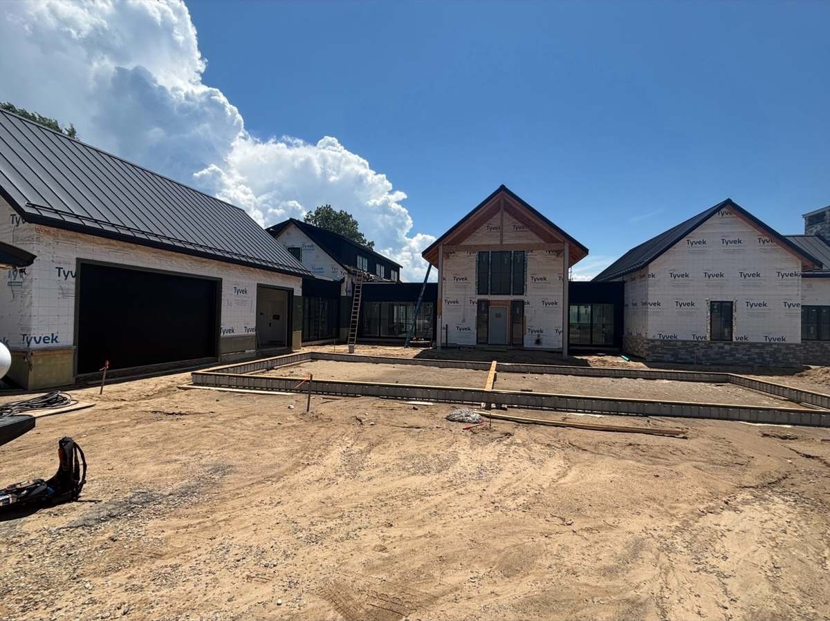 Framed courtyard with house wrap