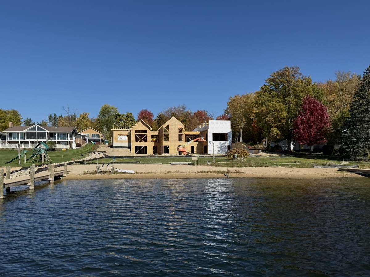 Framed home viewed from the lake