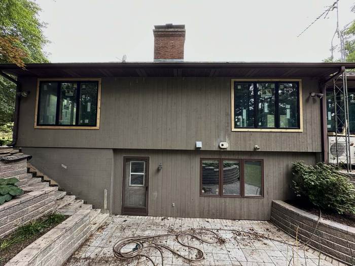 Original siding and windows before replacement