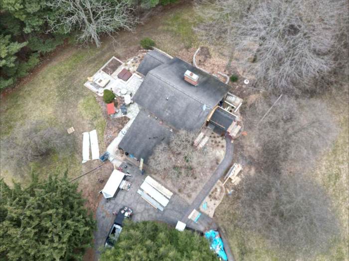 Worn shingle roof before replacement